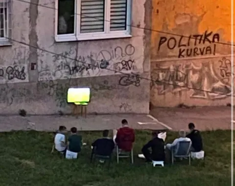 Squatting Slavs in tracksuits