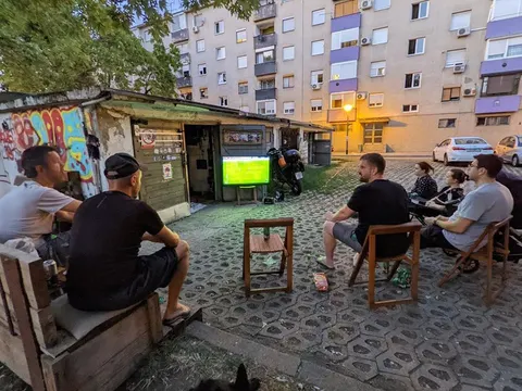 Squatting Slavs in tracksuits